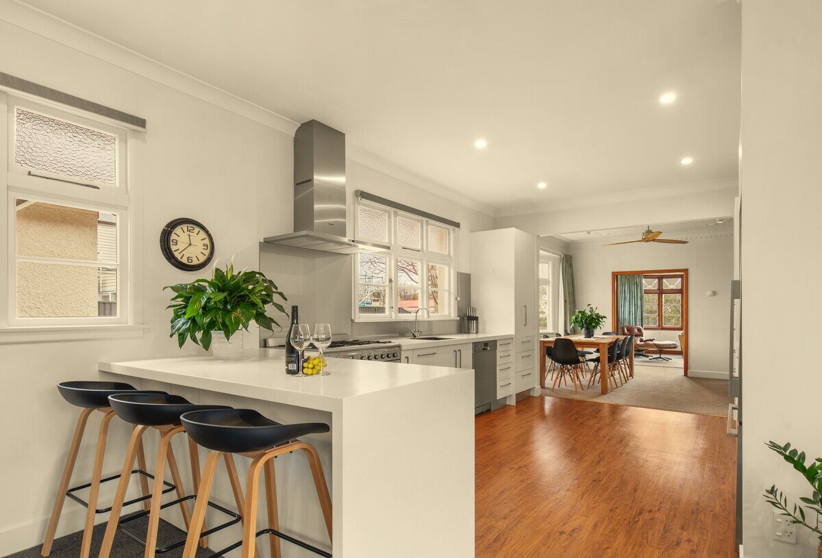 Large fully equipped kitchen with island and bar seating