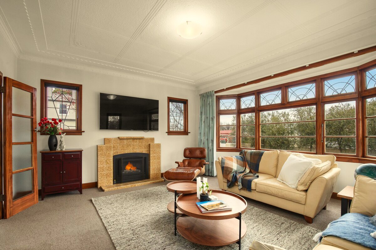 Classical sitting room with gas fire and leaded bay windows